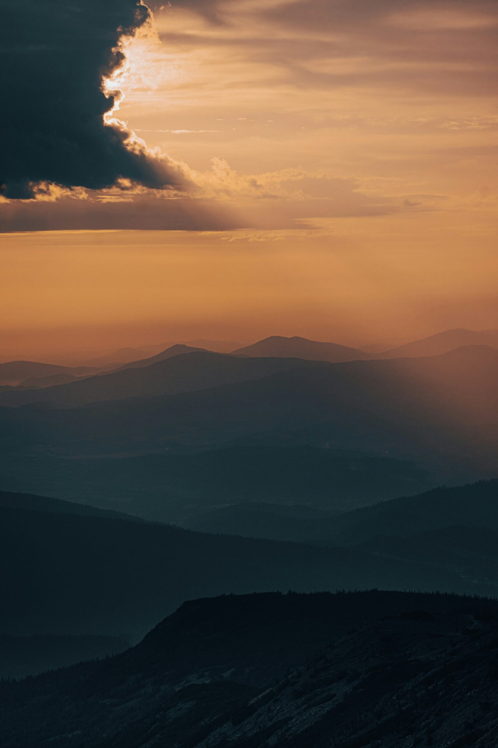 mountains under white clouds during daytime